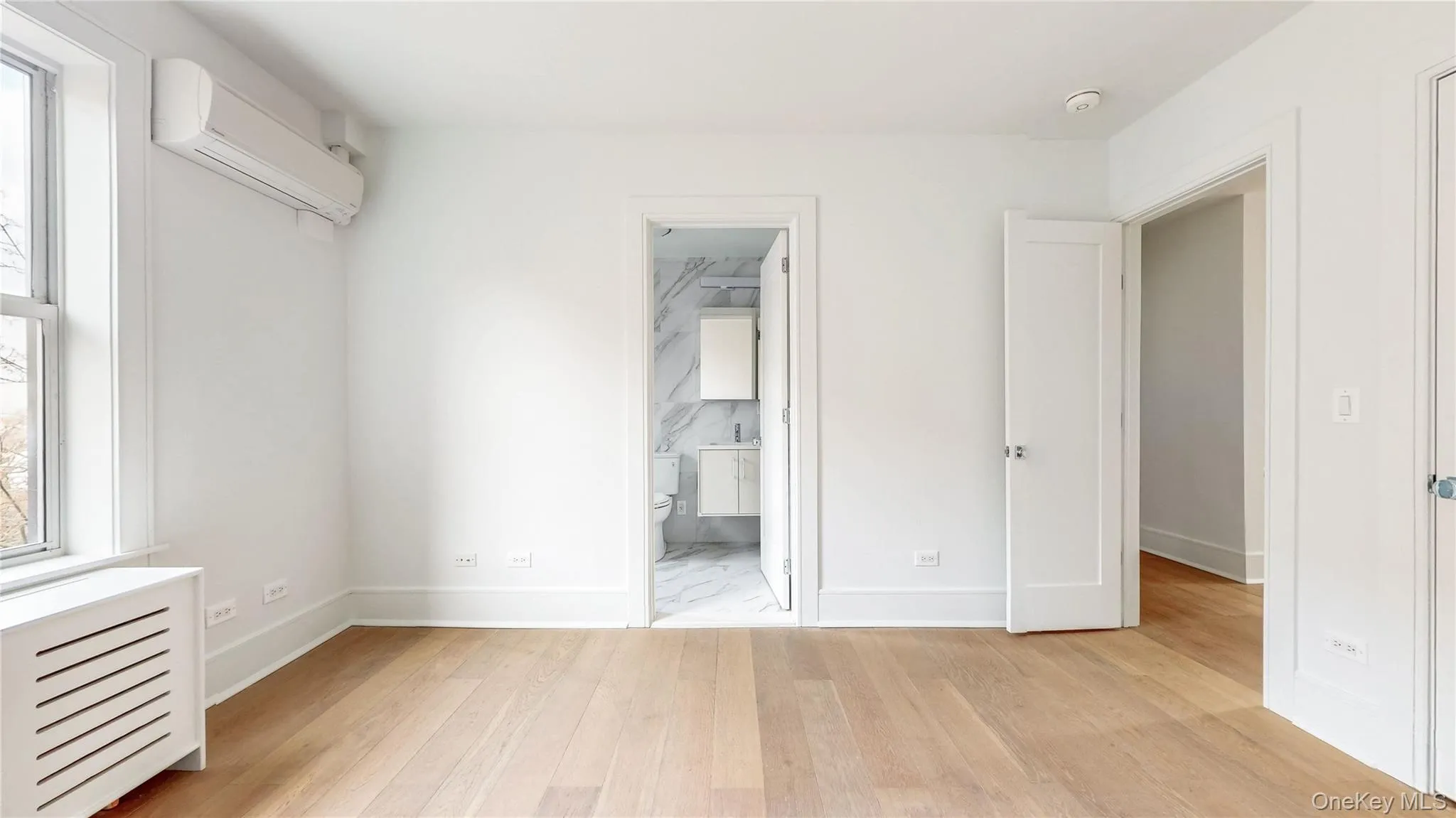 Light wood-finish flooring, crisp white walls, and bright white trim Light wood-finish flooring, crisp white walls, and bright white trim