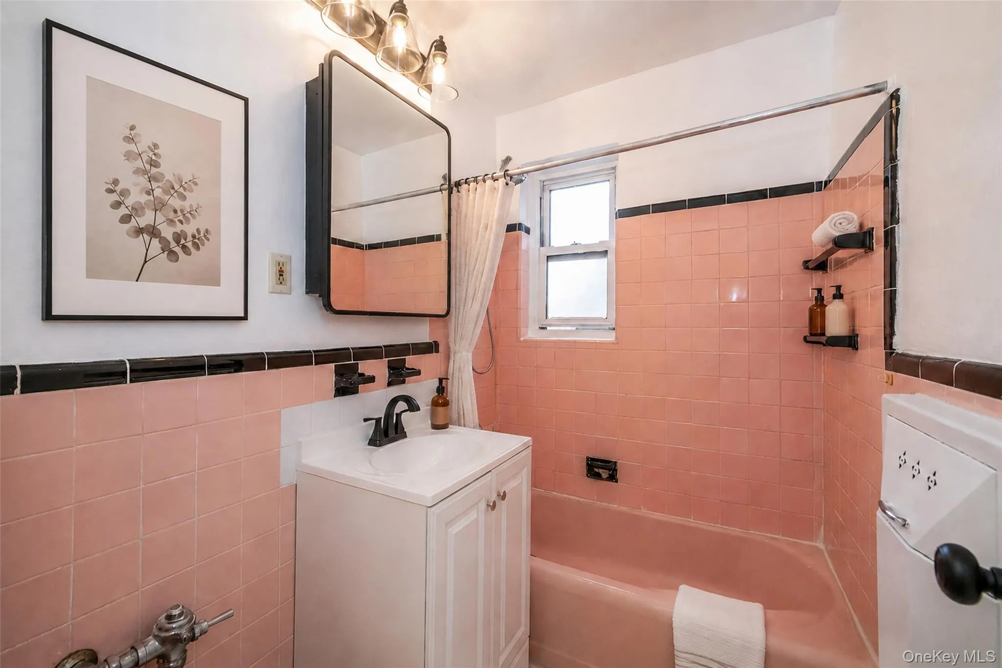 Updated bath with new vanity and mirror Updated bath with new vanity and mirror