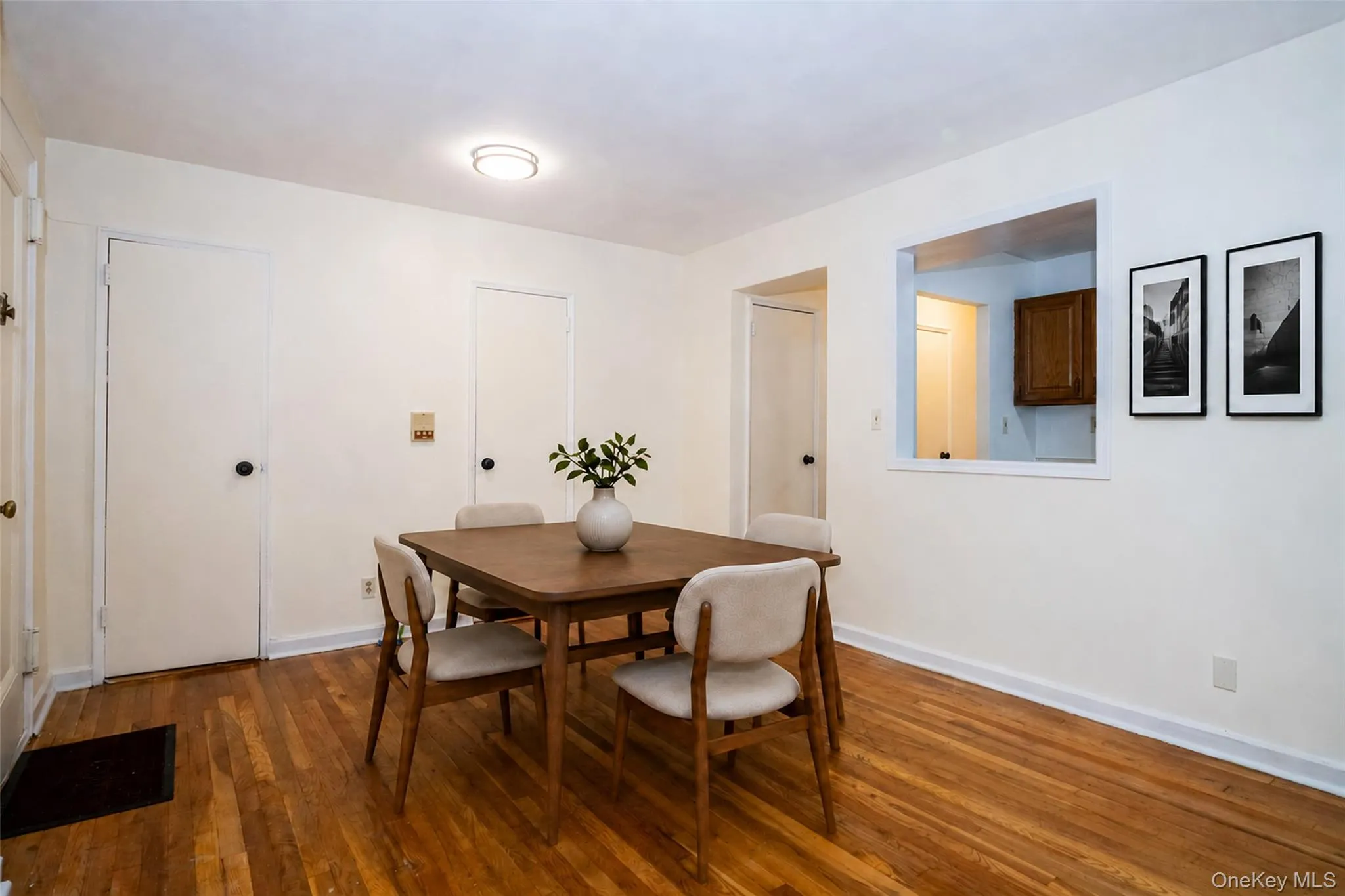 Lovely entry to large dining area with pass through to kitchen.**all interior photos virtually staged Lovely entry to large dining area with pass through to kitchen.**all interior photos virtually staged