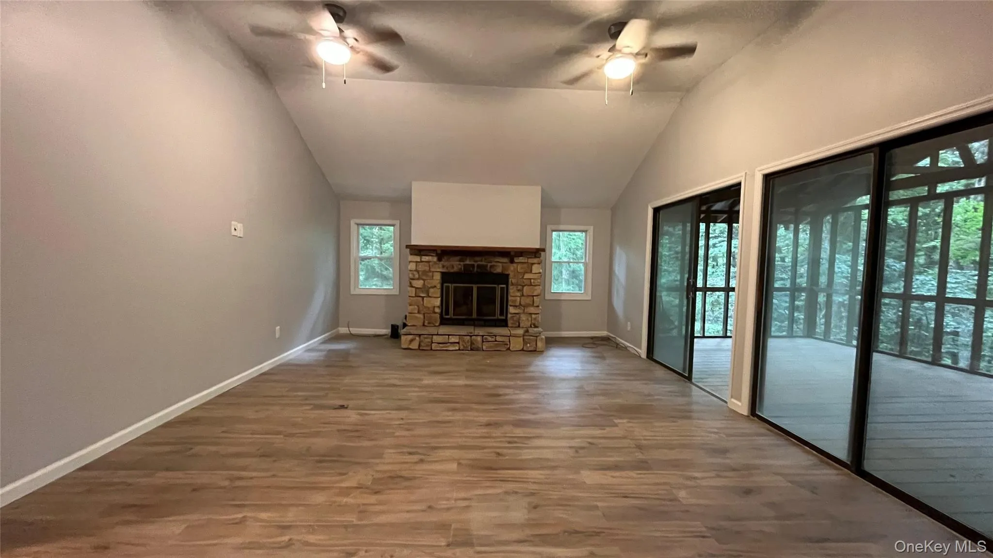 Living room w beautiful stacked stone wood burning fireplace Living room w beautiful stacked stone wood burning fireplace