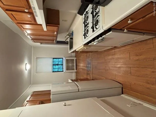 Galley kitchen with window and breakfast area Galley kitchen with window and breakfast area