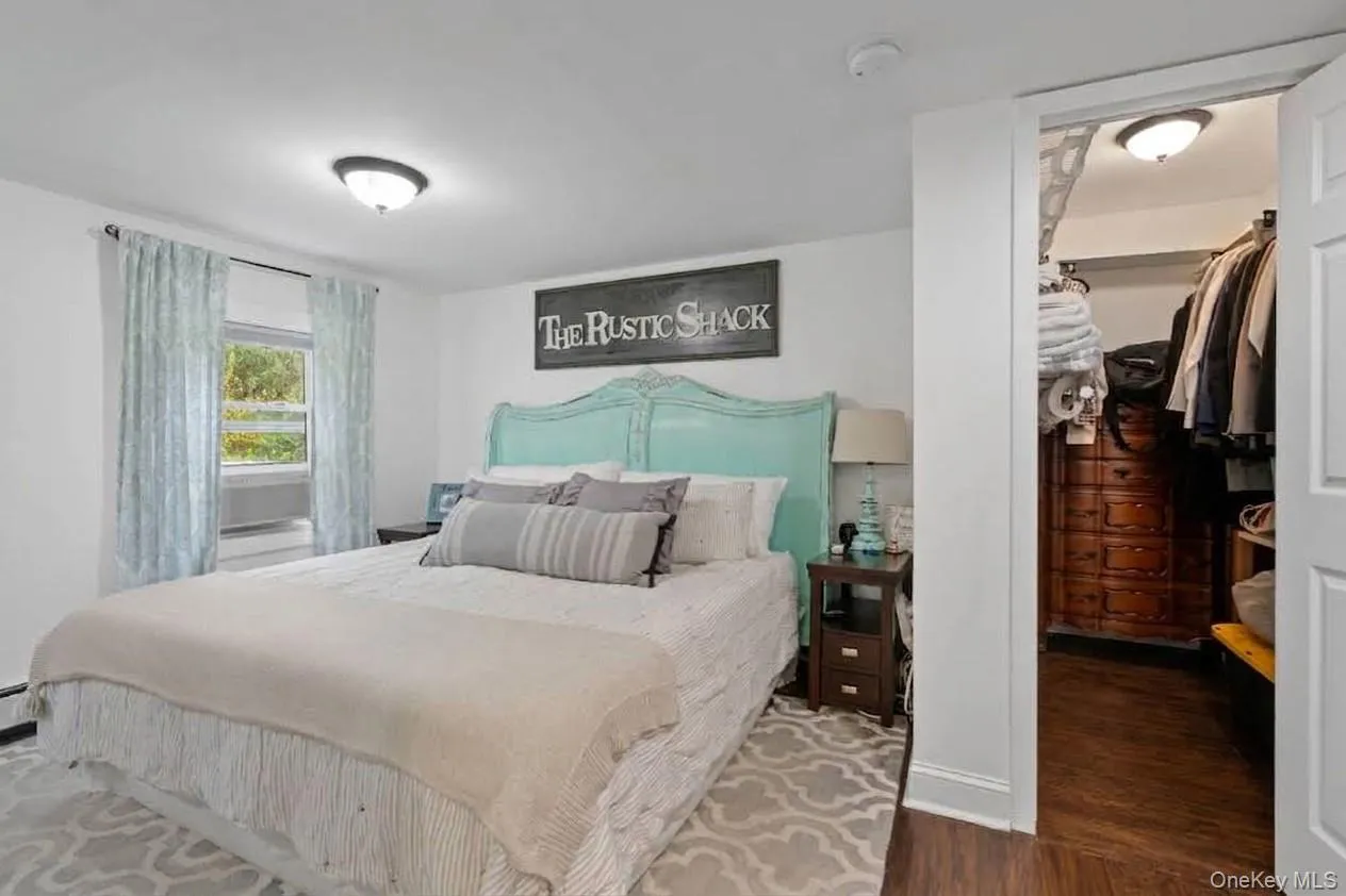 Wood-finish flooring, overhead lighting, and white wall finishes Wood-finish flooring, overhead lighting, and white wall finishes