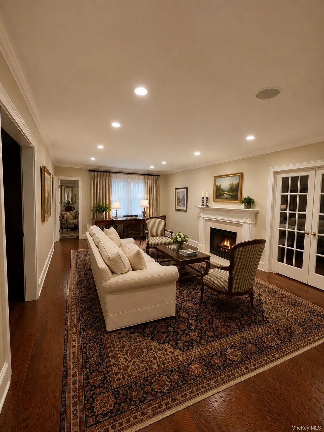 Hardwood flooring complemented by crown molding and recessed lighting Hardwood flooring complemented by crown molding and recessed lighting