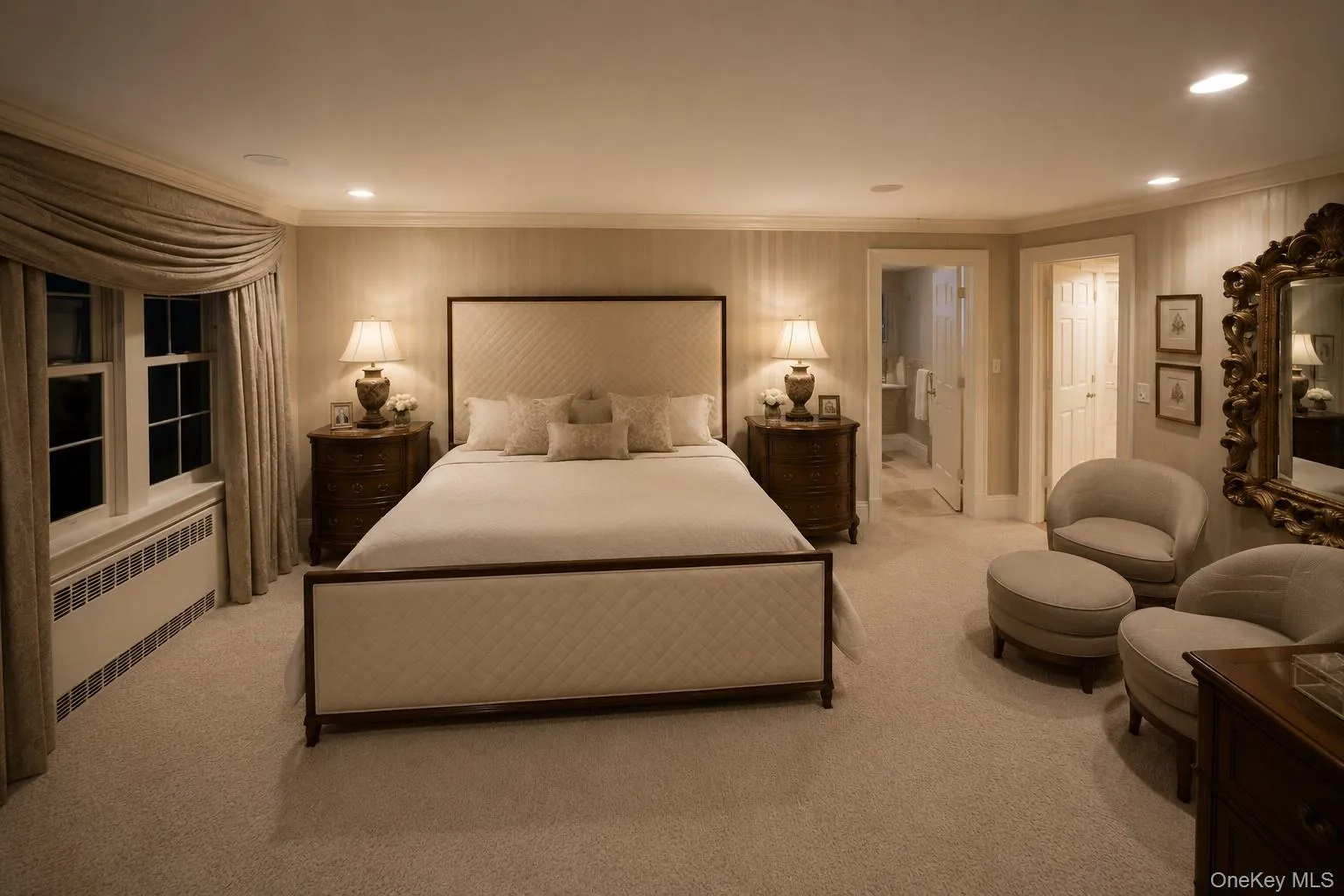 Wall-to-wall carpeting with crown molding, double-hung windows, and a built-in radiator Wall-to-wall carpeting with crown molding, double-hung windows, and a built-in radiator