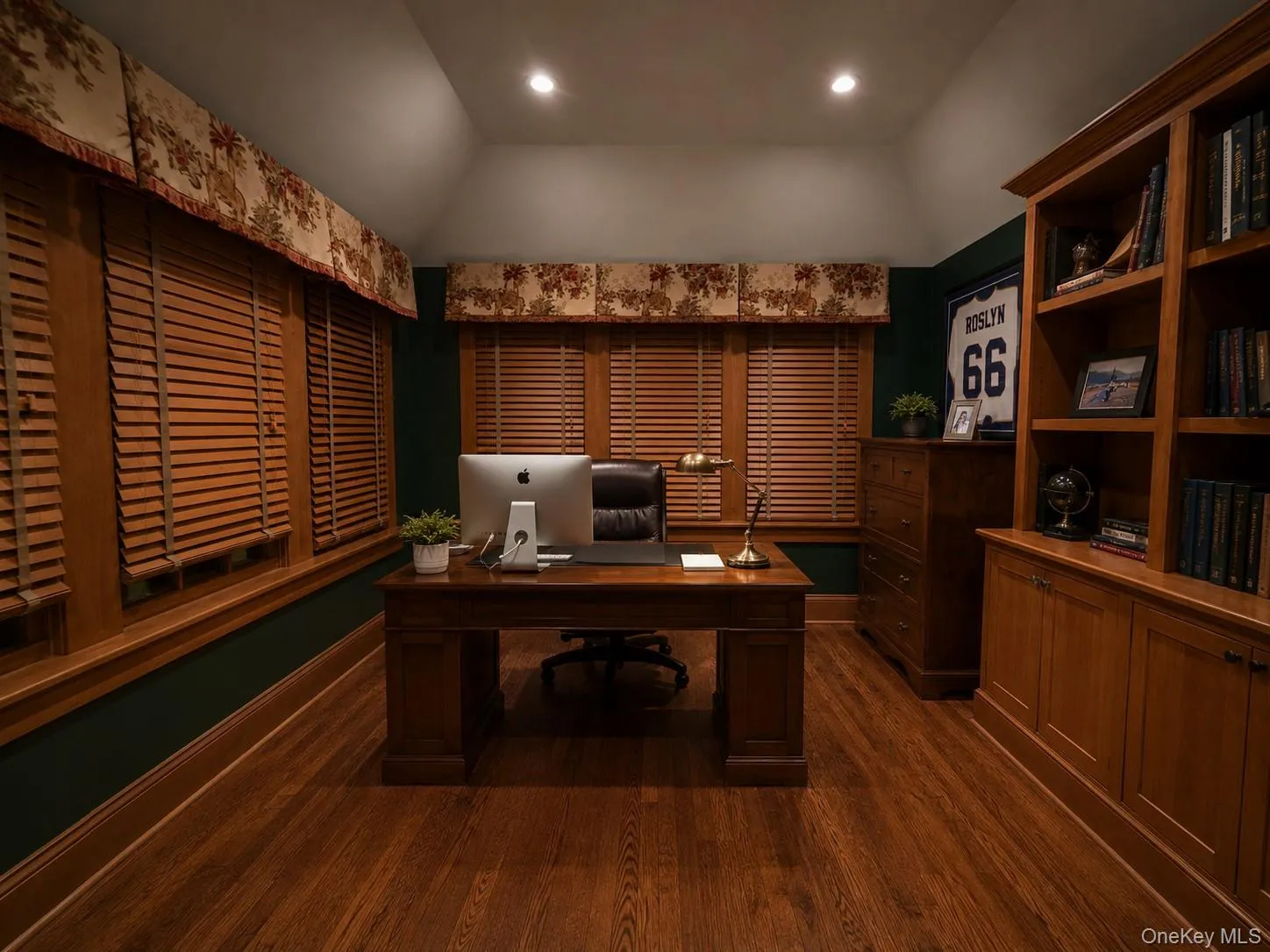 Hardwood flooring, custom built-in cabinetry, recessed lighting, wood blinds, and detailed window valances Hardwood flooring, custom built-in cabinetry, recessed lighting, wood blinds, and detailed window valances