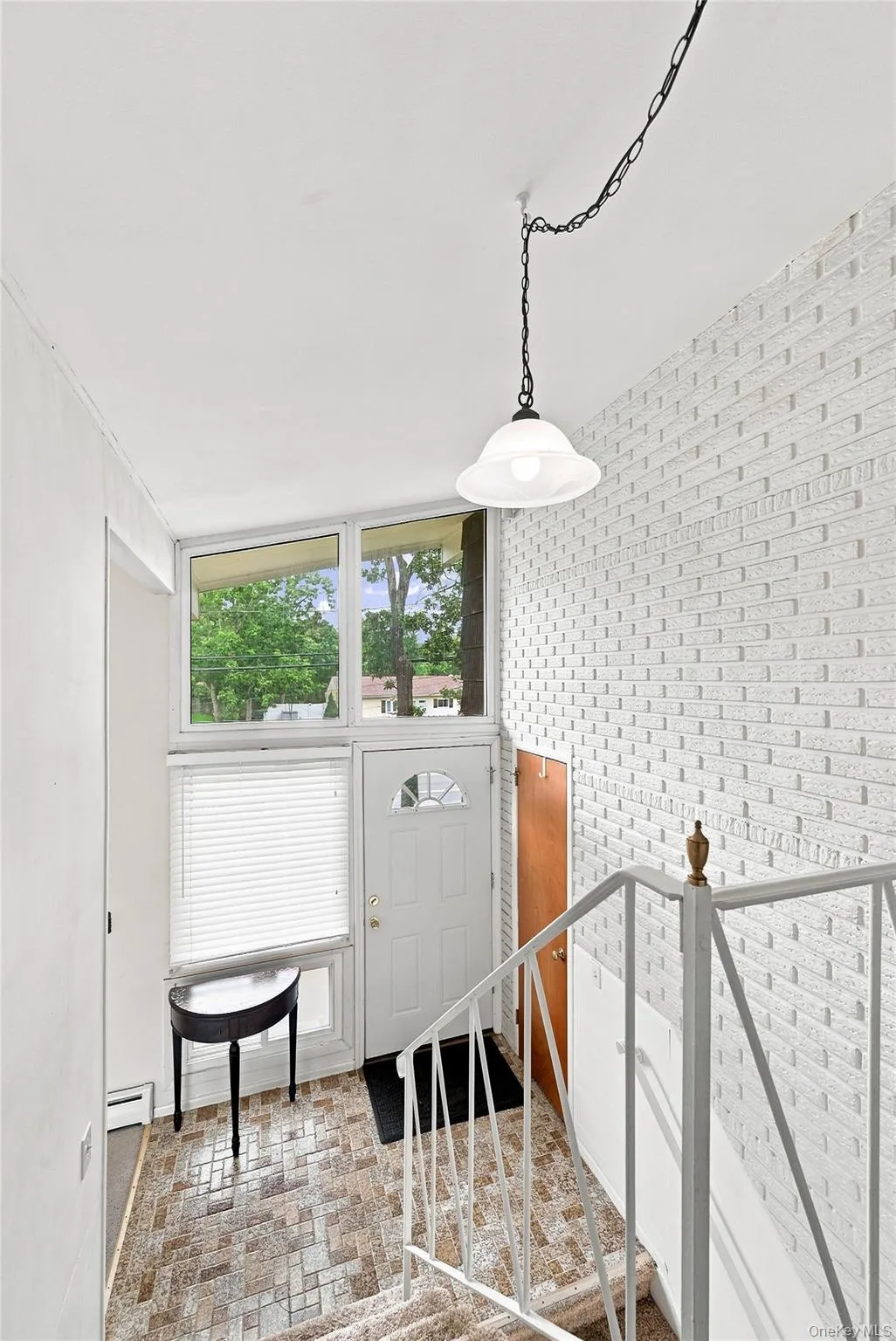 Foyer is on the same level as the living room. Up to the 3 bedrooms/full bath and down to the dining room, kitchen and half bath Foyer is on the same level as the living room. Up to the 3 bedrooms/full bath and down to the dining room, kitchen and half bath