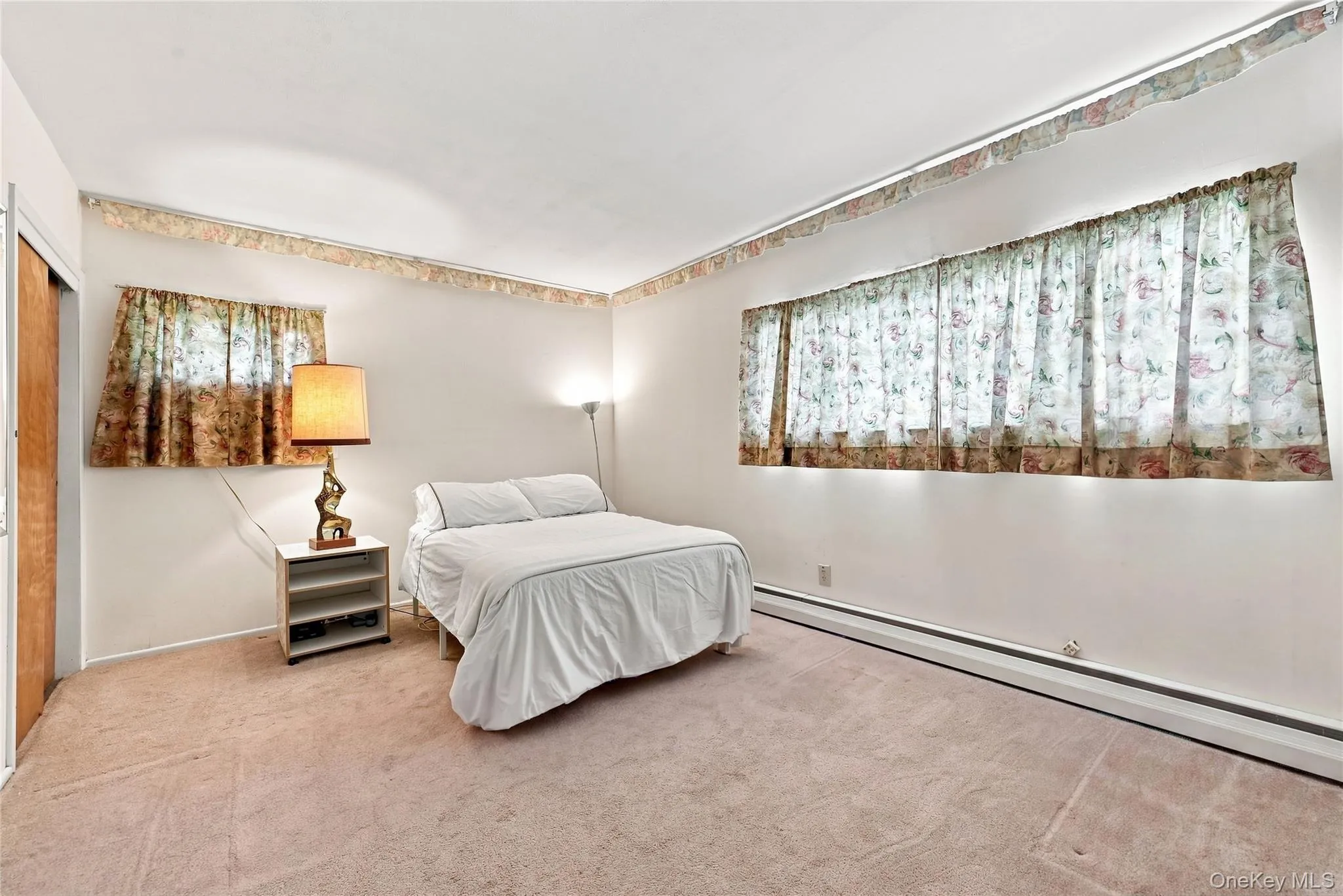 Bedroom #2 with 2 closets and hardwood floors under the carpet Bedroom #2 with 2 closets and hardwood floors under the carpet