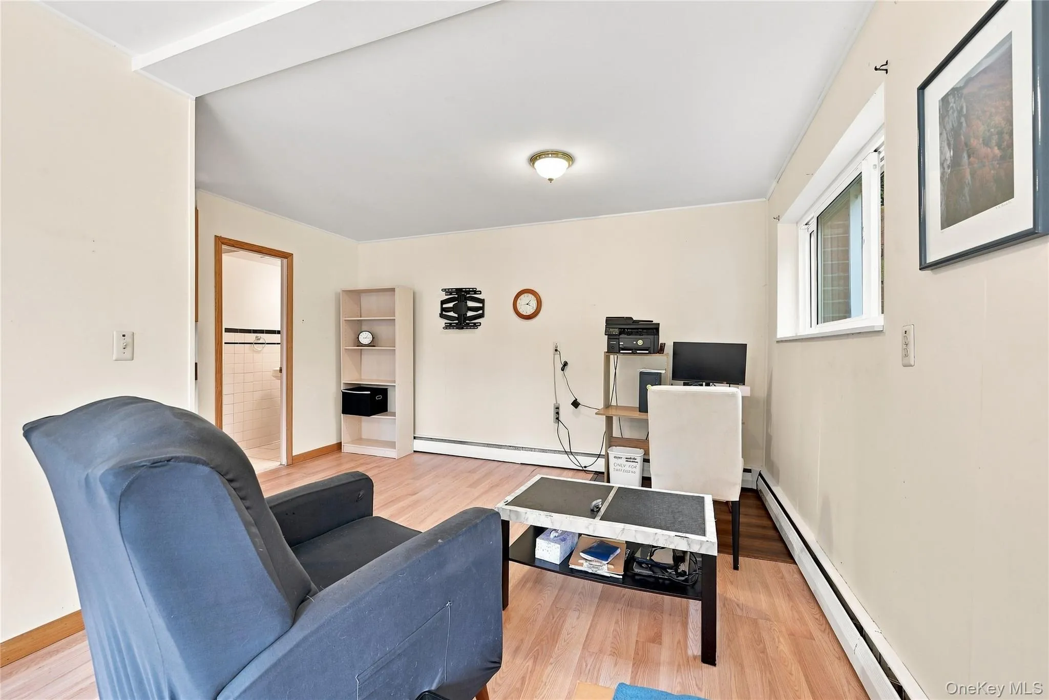 Den with adjacent half bath. Laminate floors Den with adjacent half bath. Laminate floors