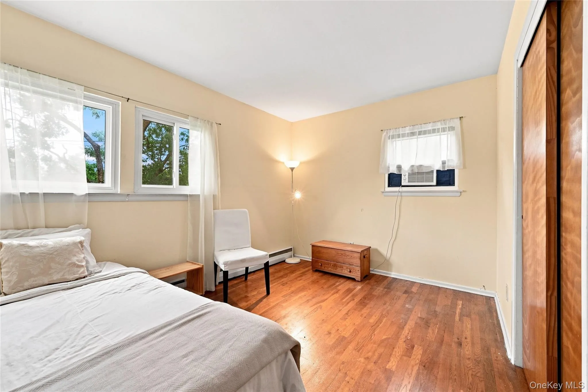 Bedroom #3 with double closet and exposed hardwood floors Bedroom #3 with double closet and exposed hardwood floors