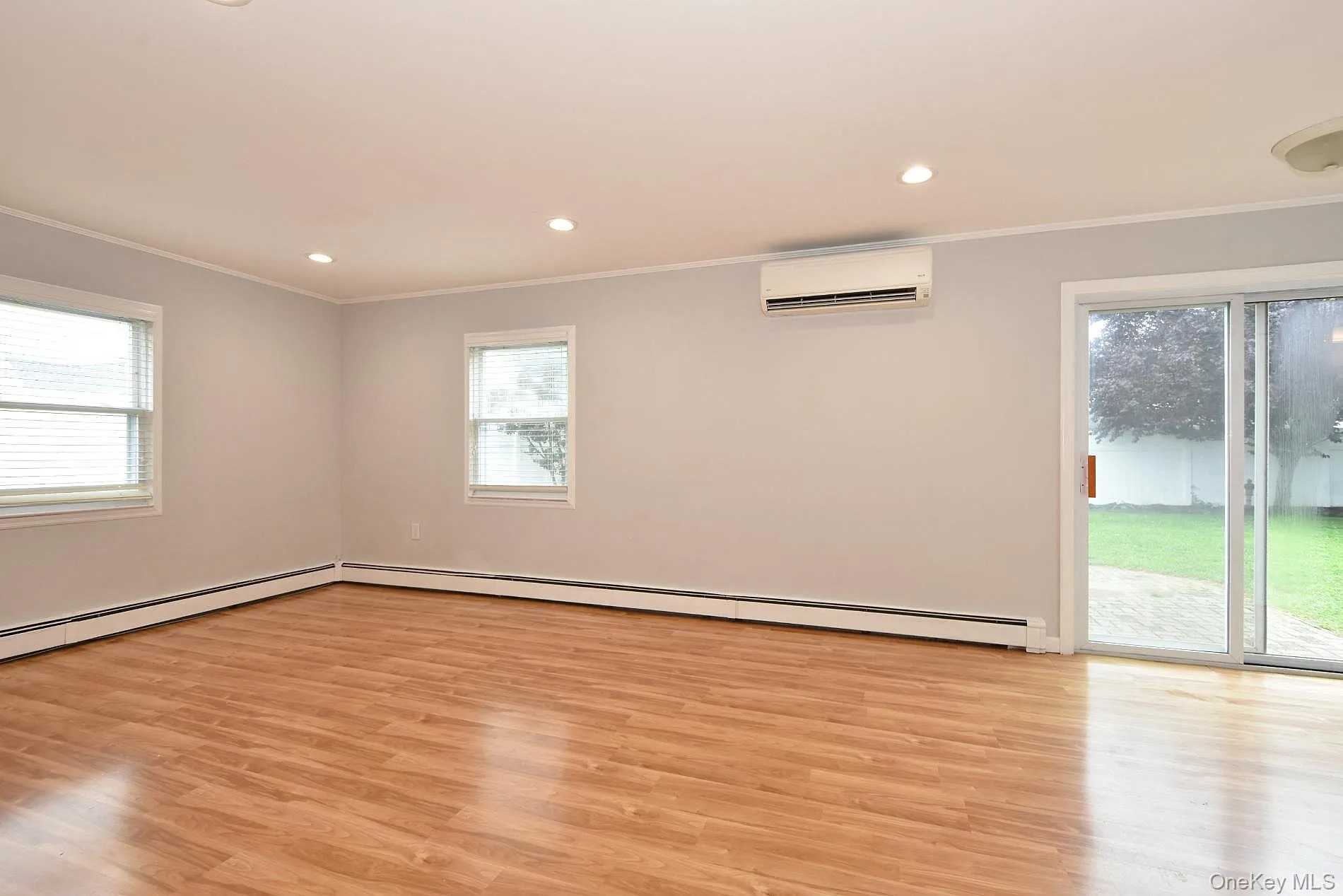 Den with sliding doors to the patio & backyard Den with sliding doors to the patio & backyard
