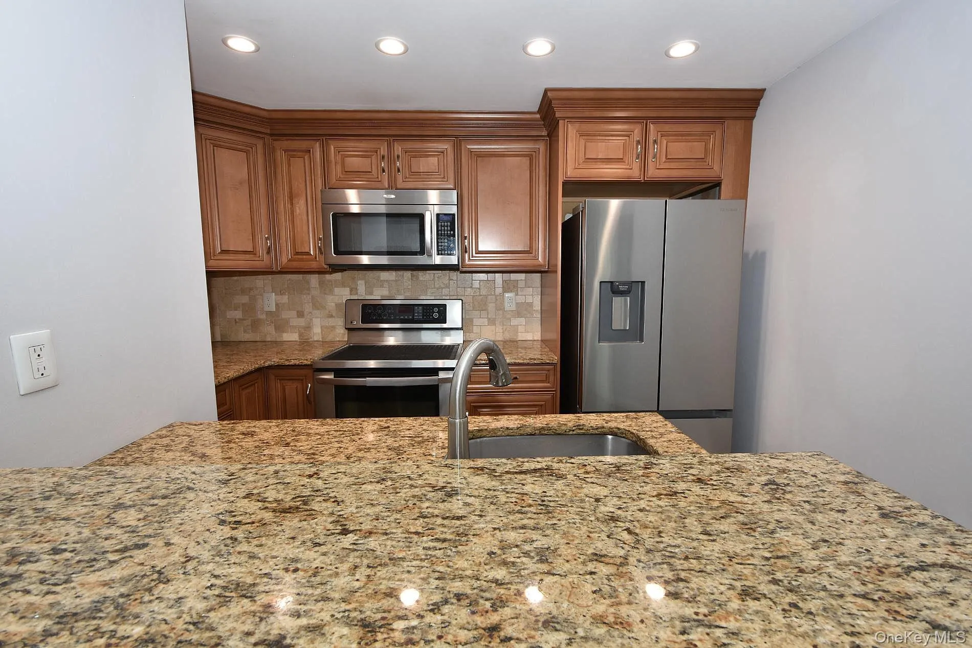Breakfast Bar and stainless appliances including a dishwasher Breakfast Bar and stainless appliances including a dishwasher