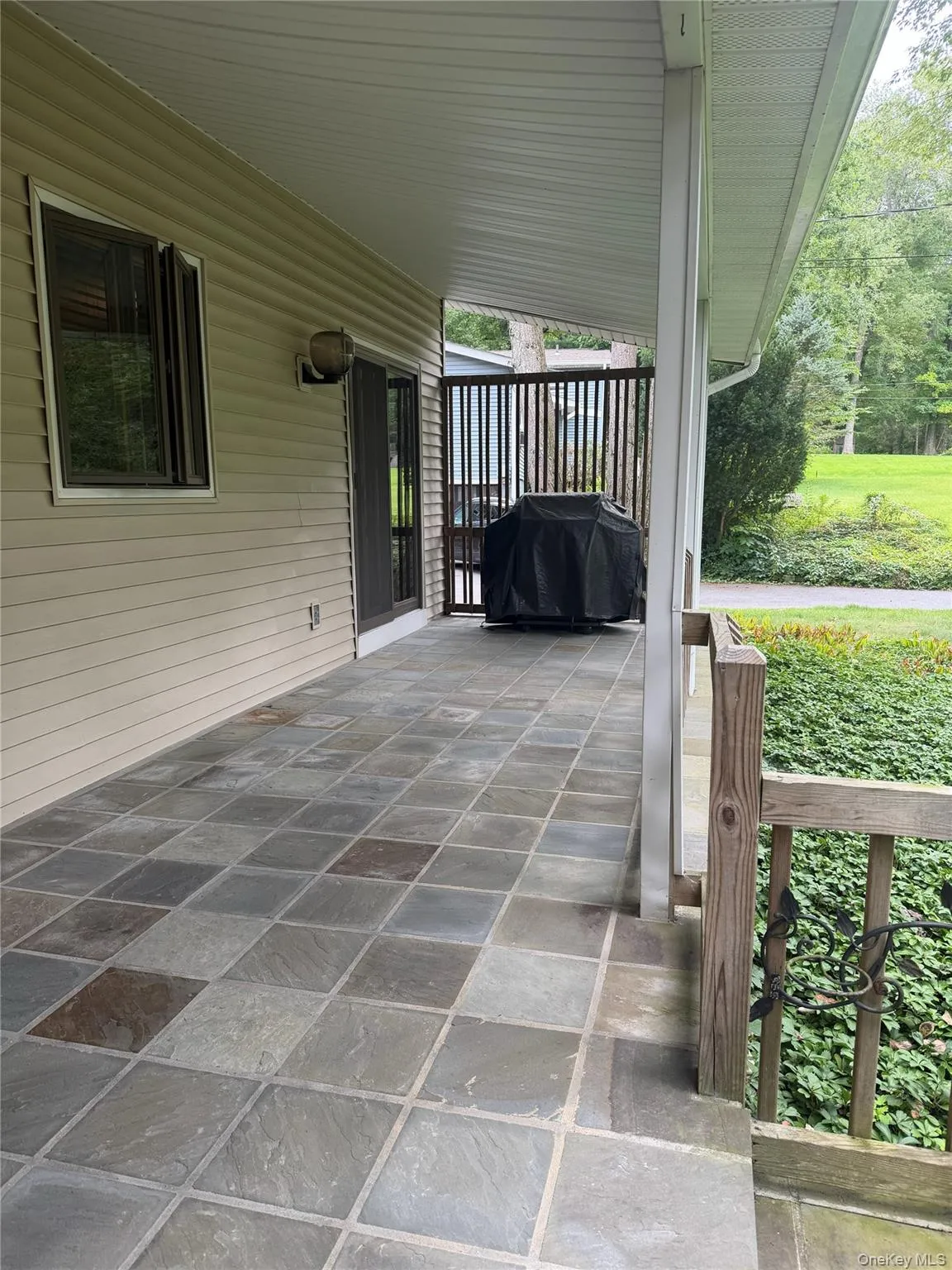 Covered Entry Front patio with Bluestone Tiles Covered Entry Front patio with Bluestone Tiles