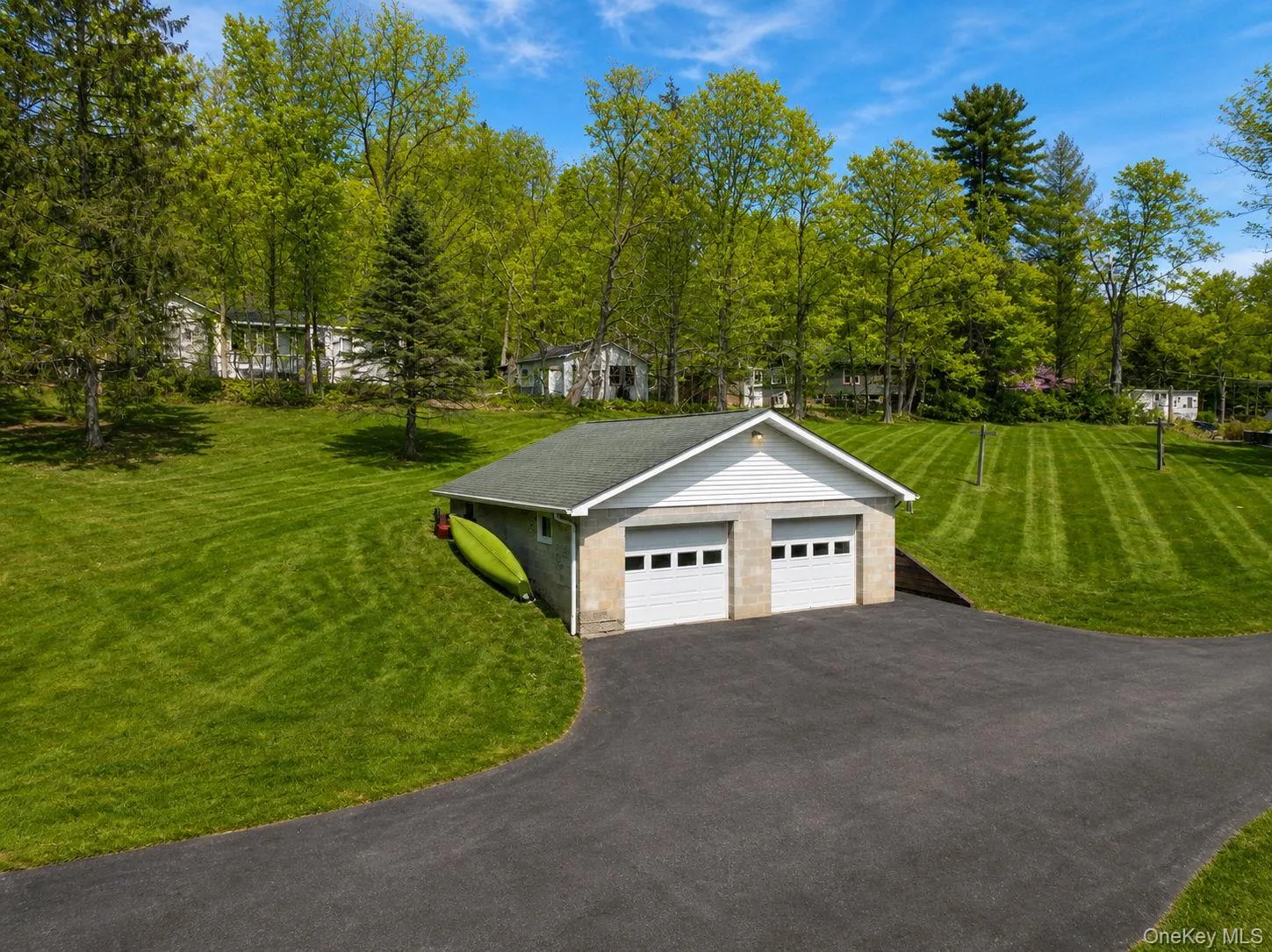 Two-car detached garage with panel doors and a gabled roof Two-car detached garage with panel doors and a gabled roof