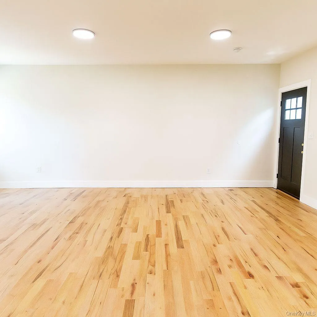 Entryway featuring wood finished floors and baseboards Entryway featuring wood finished floors and baseboards
