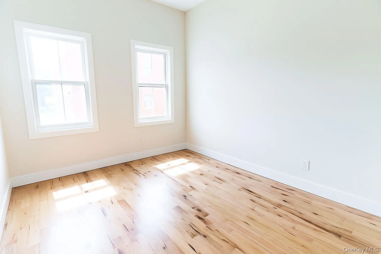 Unfurnished room with wood finished floors Unfurnished room with wood finished floors