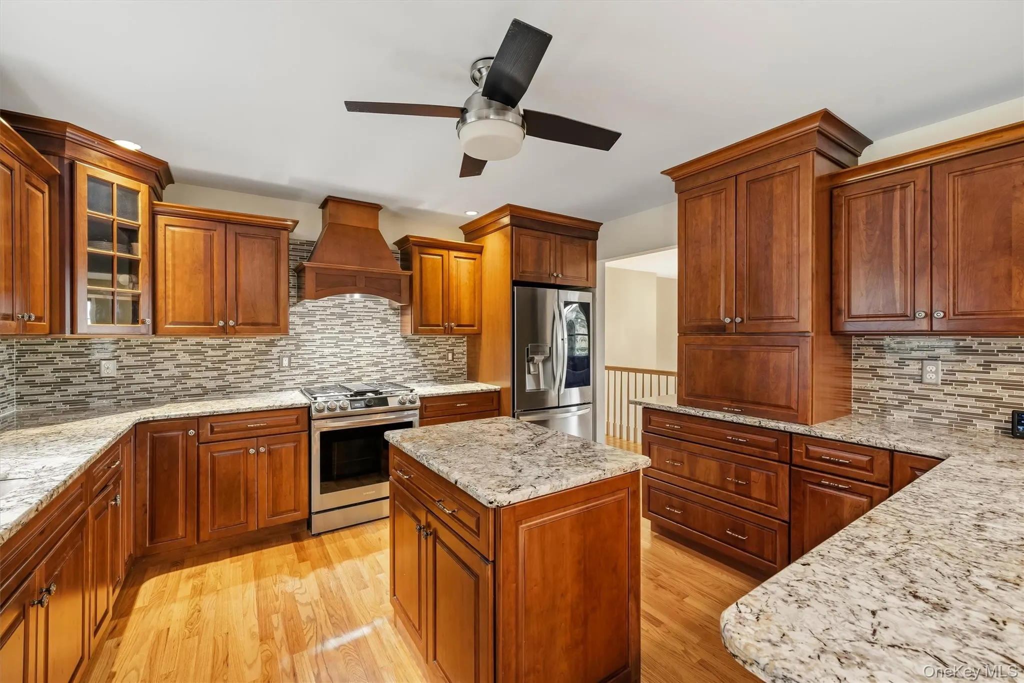 Wood-finish flooring with a kitchen island Wood-finish flooring with a kitchen island