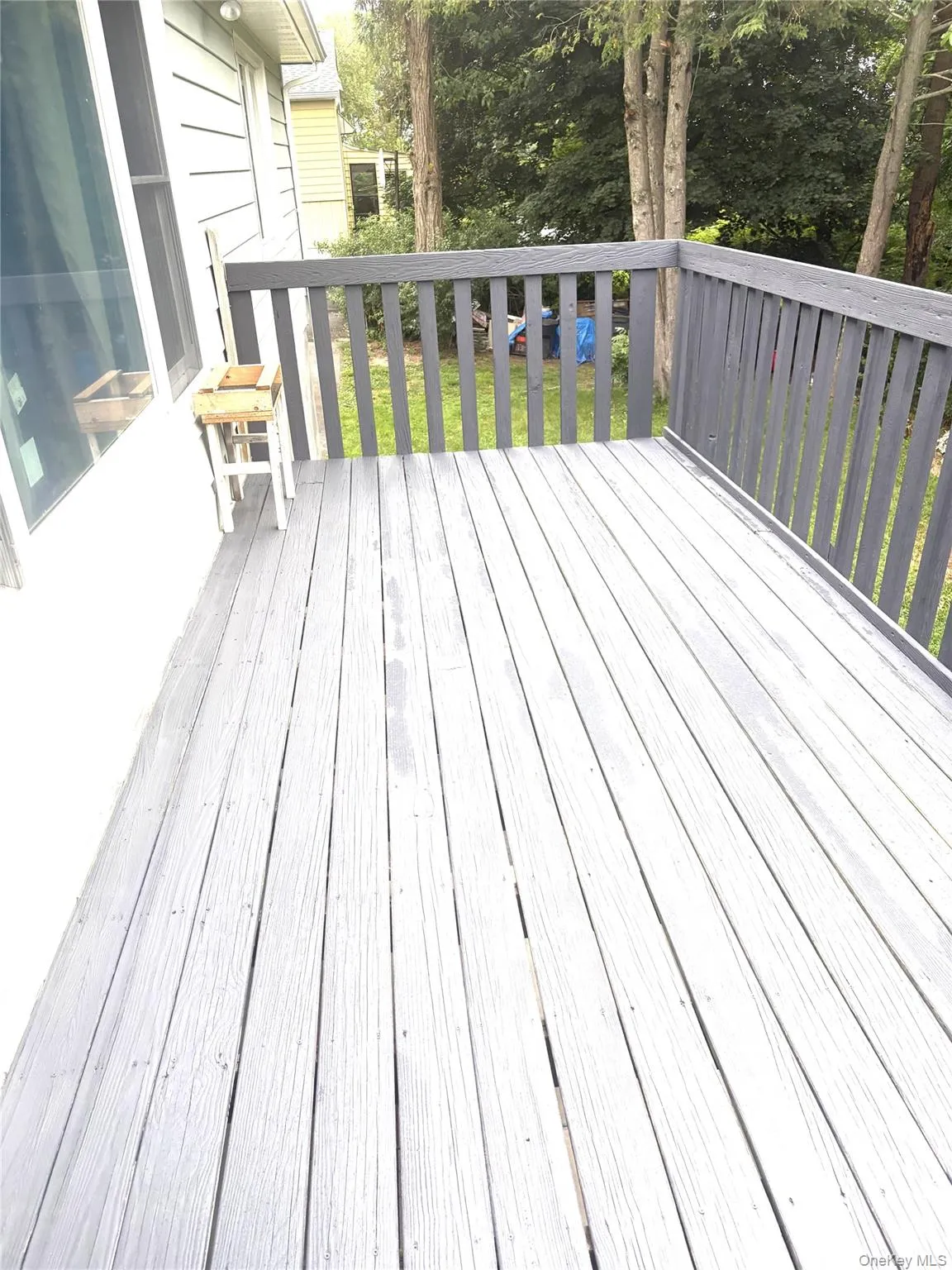 Spacious deck overlooking back yard Spacious deck overlooking back yard