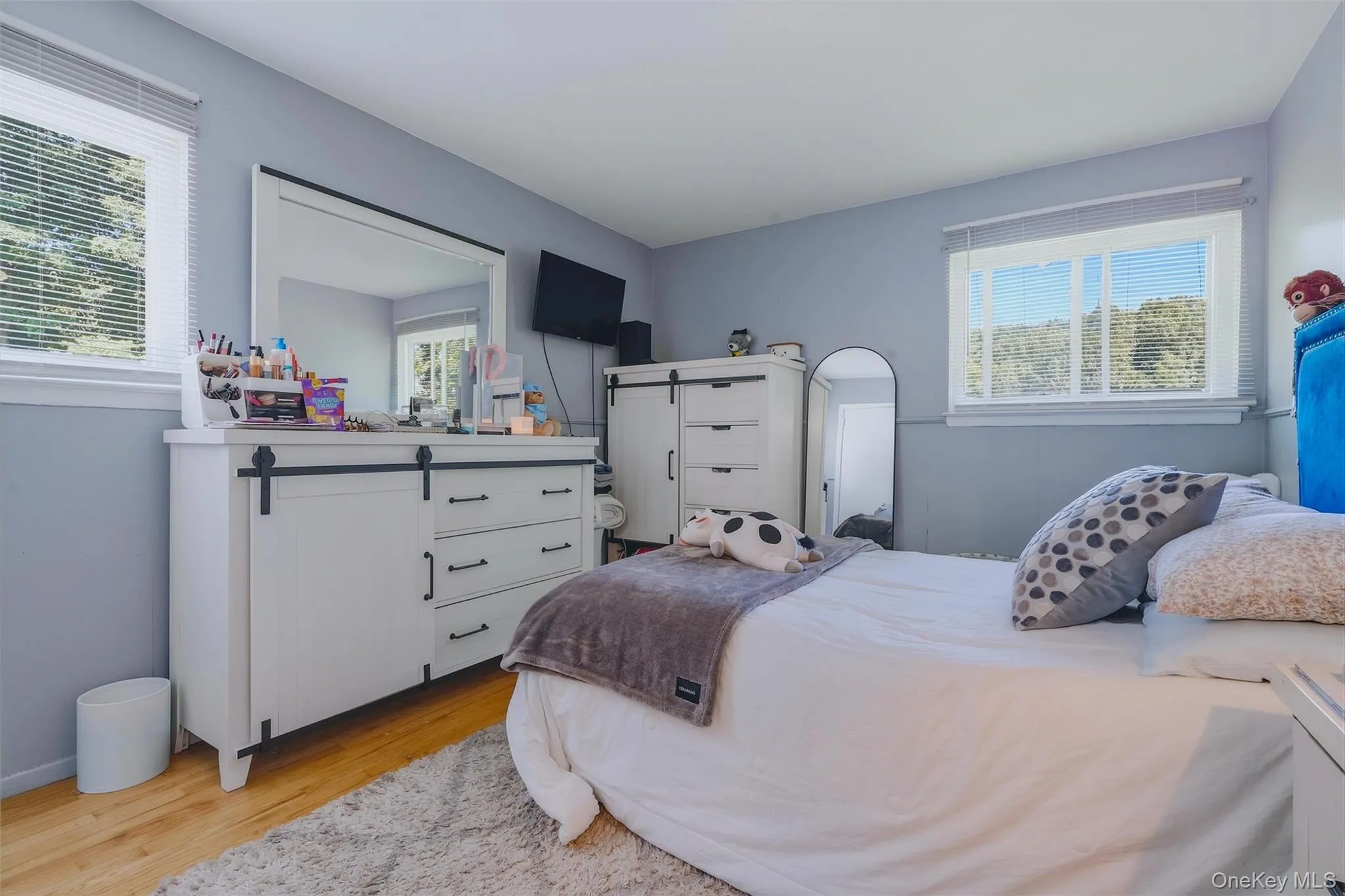 Bedroom 2 with more natural light and hardwood floors. Bedroom 2 with more natural light and hardwood floors.