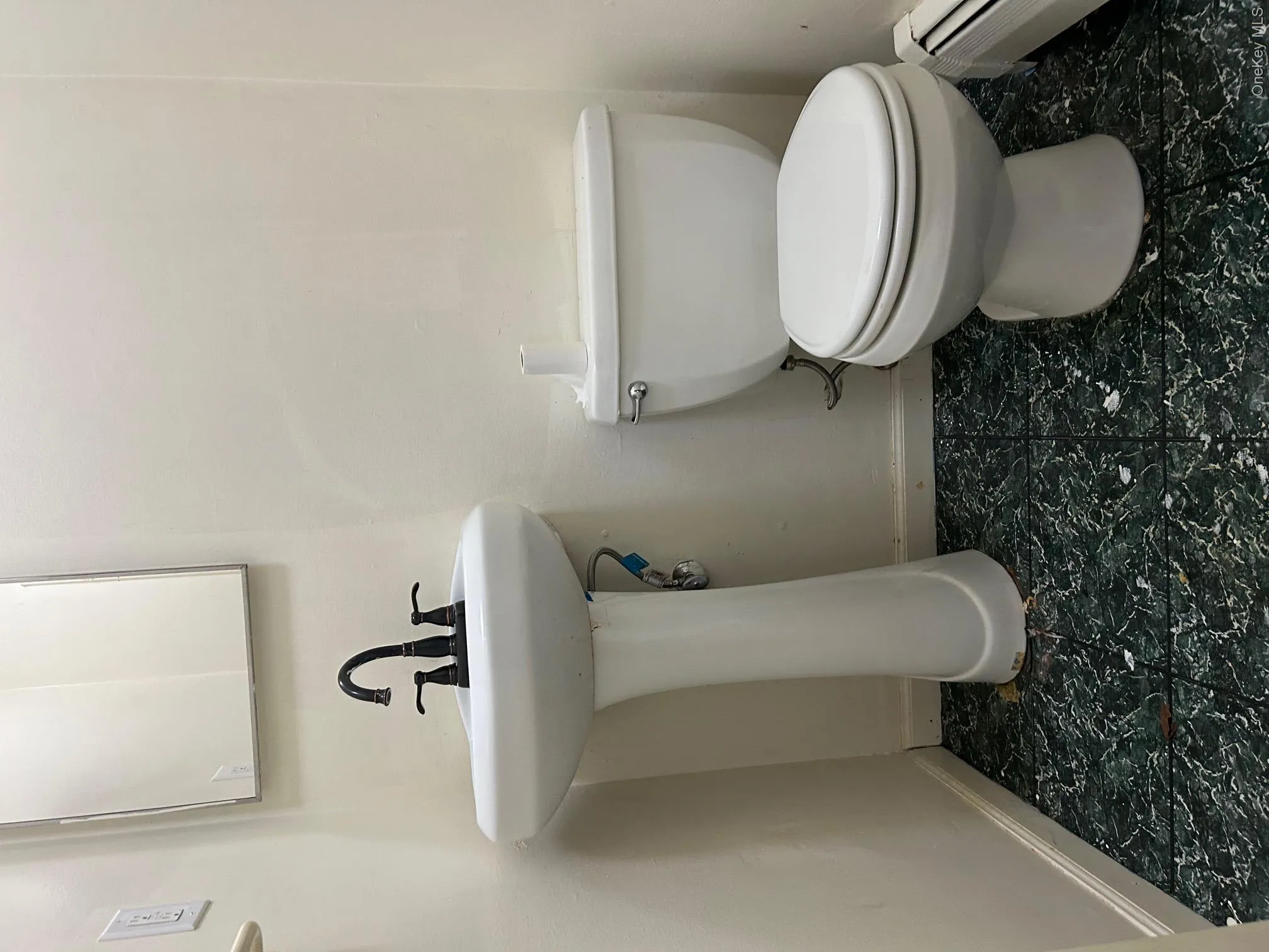 Bathroom with baseboards and a baseboard heating unit Bathroom with baseboards and a baseboard heating unit