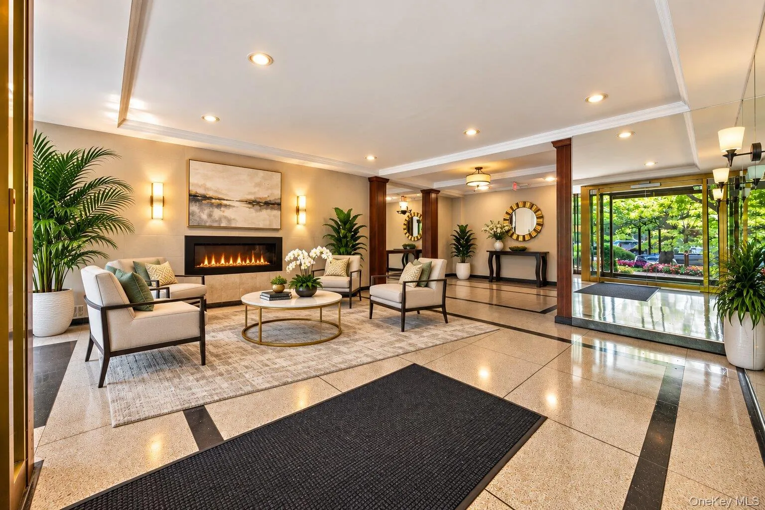 Spacious lobby featuring a modern linear fireplace, recessed lighting, and large format tile flooring with contrasting accents Spacious lobby featuring a modern linear fireplace, recessed lighting, and large format tile flooring with contrasting accents