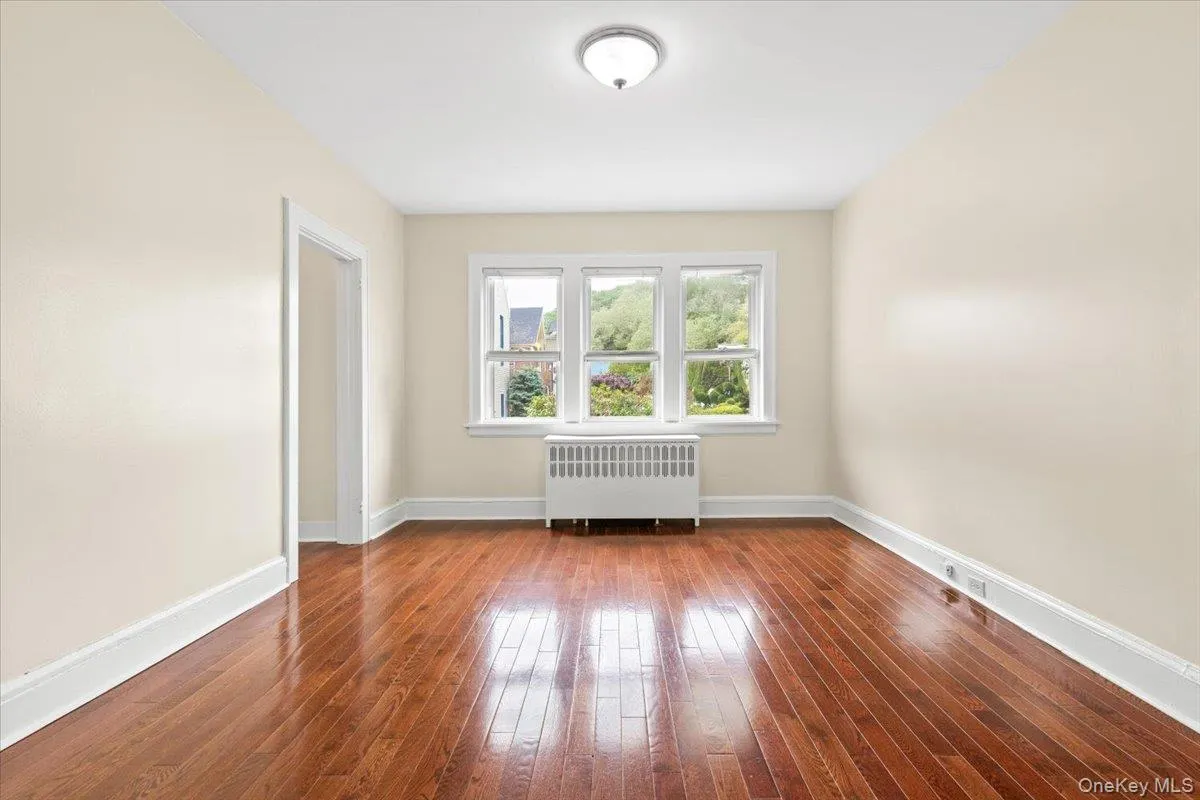 Living room with great natural light and hardwood flooring Living room with great natural light and hardwood flooring