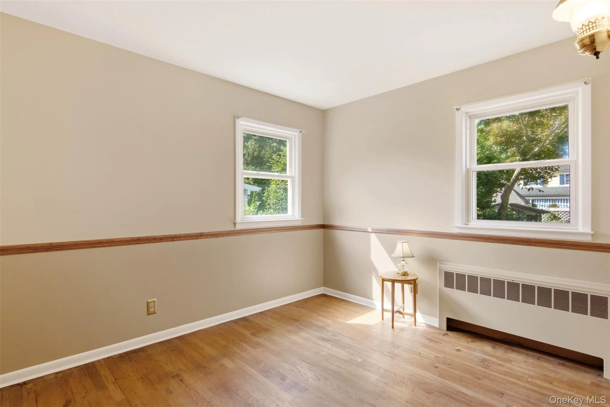 First floor bedroom 2 with hardwood floors. First floor bedroom 2 with hardwood floors.