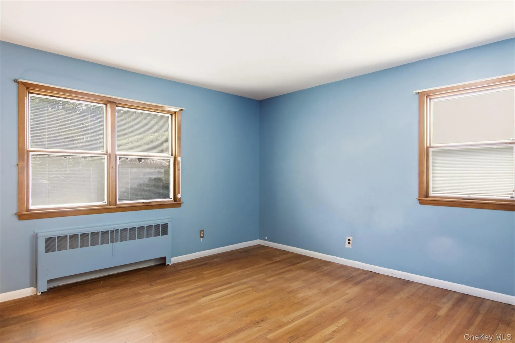 First floor bedroom 1 with hardwood floors. First floor bedroom 1 with hardwood floors.