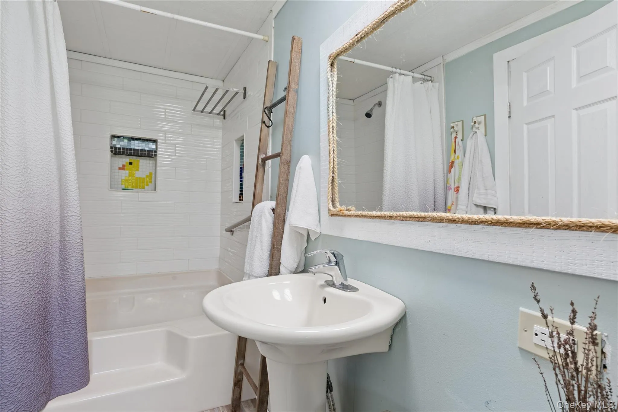 Full bath featuring shower / bath combination with curtain Full bath featuring shower / bath combination with curtain