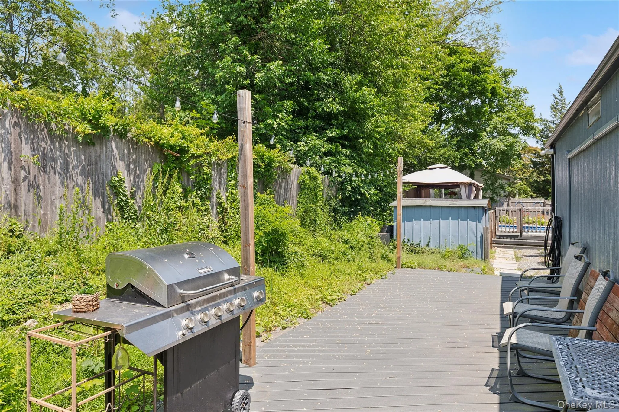 Deck featuring grilling area and a gazebo Deck featuring grilling area and a gazebo