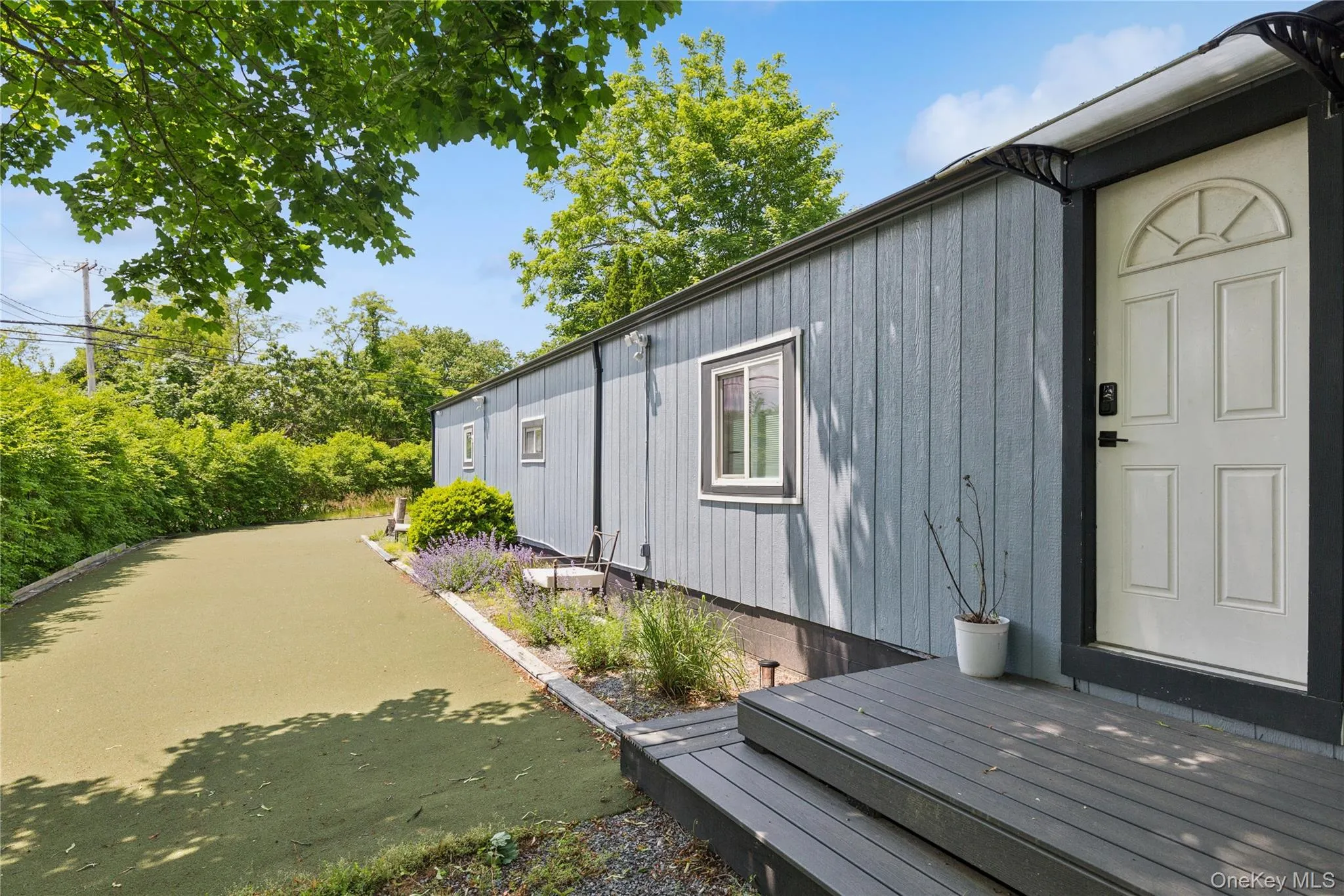 View of home's exterior featuring a deck View of home's exterior featuring a deck
