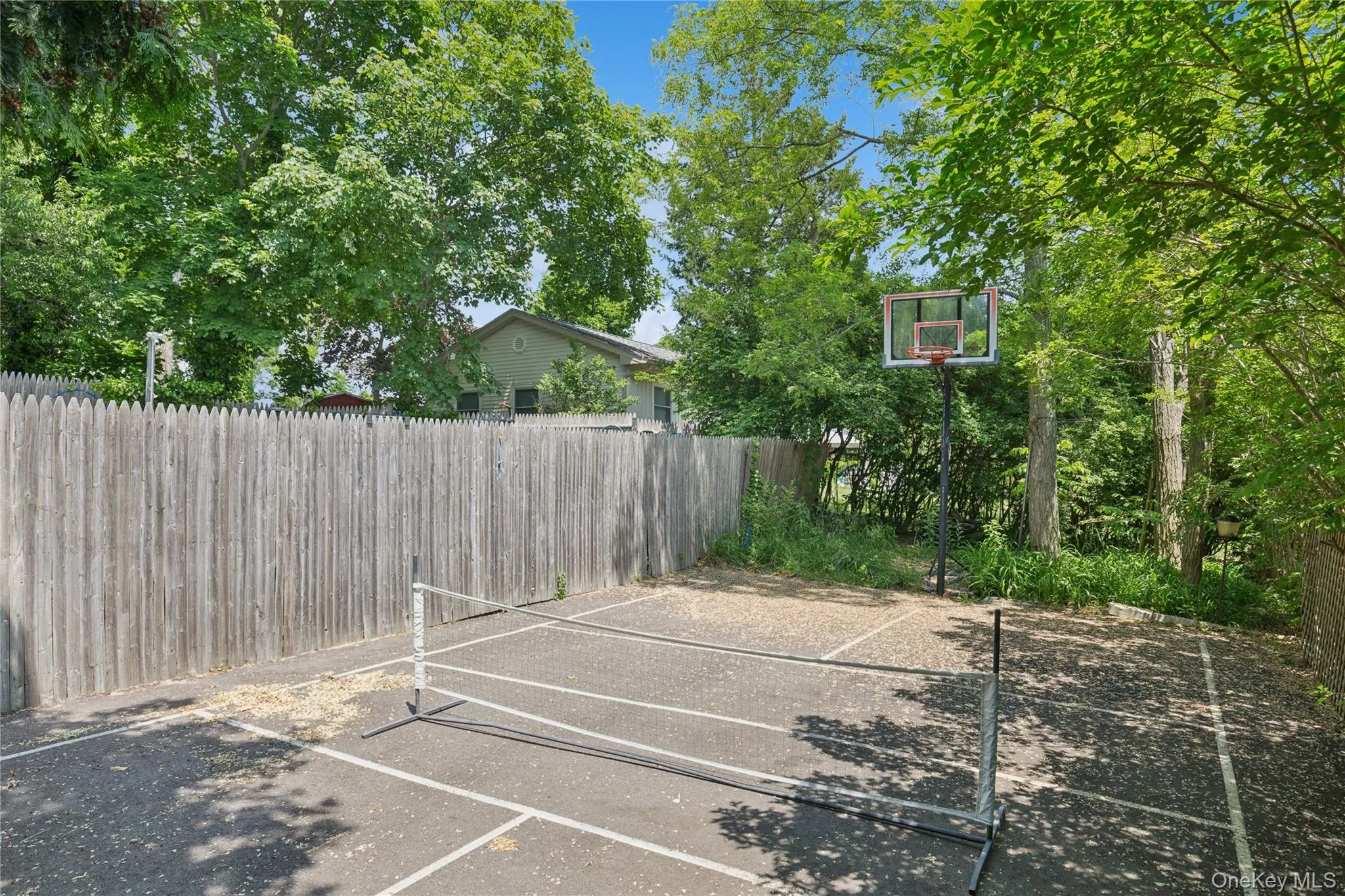 View of sport court featuring basketball court View of sport court featuring basketball court