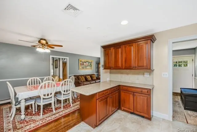 The Open Kitchen enters into the Dining Room for Entertaining The Open Kitchen enters into the Dining Room for Entertaining