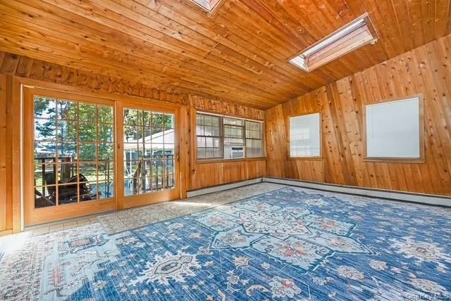 The Cedar Sunroom Leads out to the Backyard. The Cedar Sunroom Leads out to the Backyard.