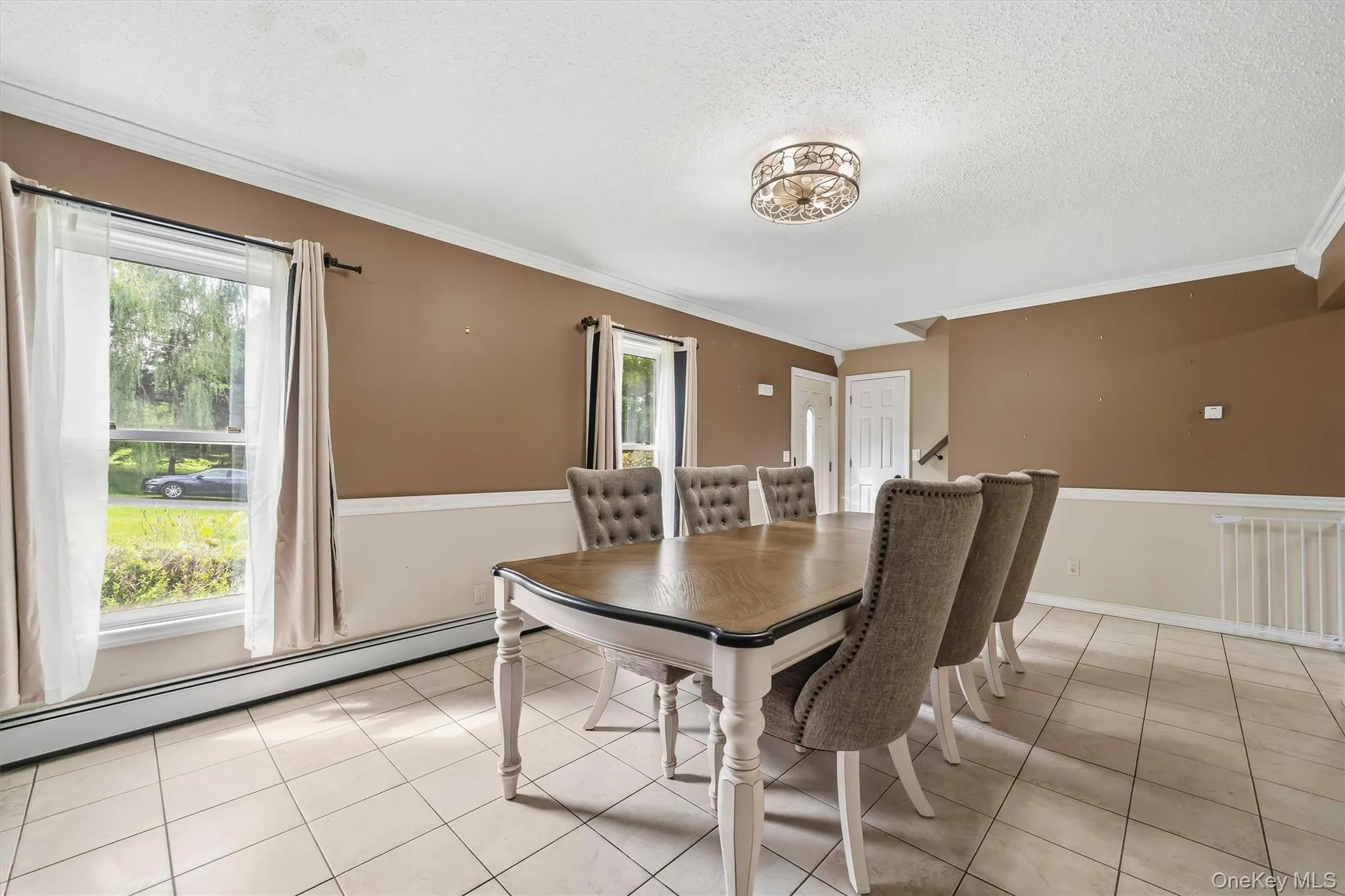 Spacious dining area with large windows providing plenty of natural light. Spacious dining area with large windows providing plenty of natural light.