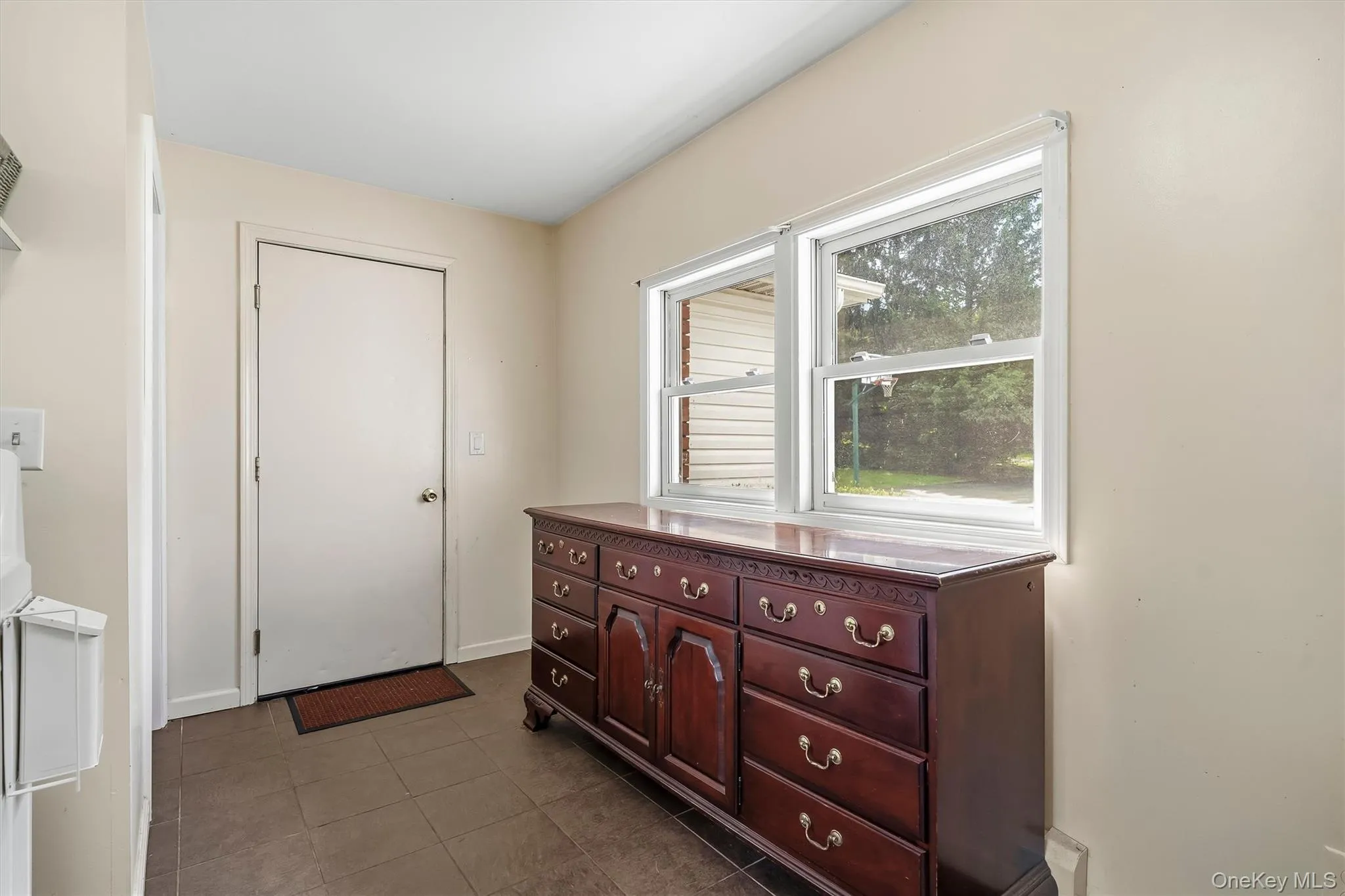 Convenient mudroom with exterior access and natural light. Convenient mudroom with exterior access and natural light.