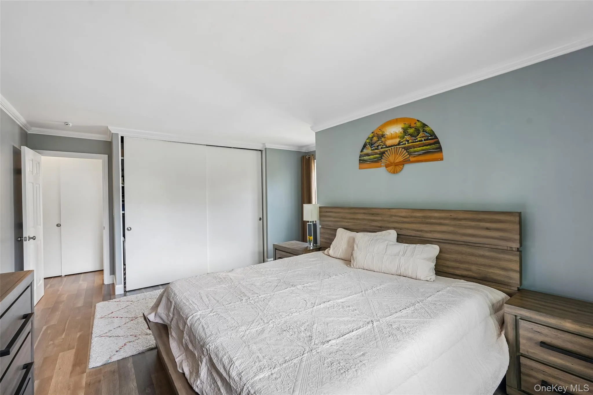 Hardwood-finish flooring, sliding closet doors, and crown molding Hardwood-finish flooring, sliding closet doors, and crown molding