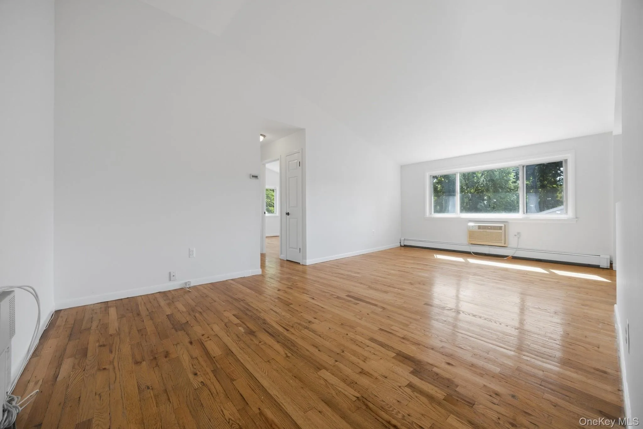 The living room as it actually appears. Another view emphasizes the living room’s expansive floor space, high ceilings and flexibility for furniture placement. The living room as it actually appears. Another view emphasizes the living room’s expansive floor space, high ceilings and flexibility for furniture placement.