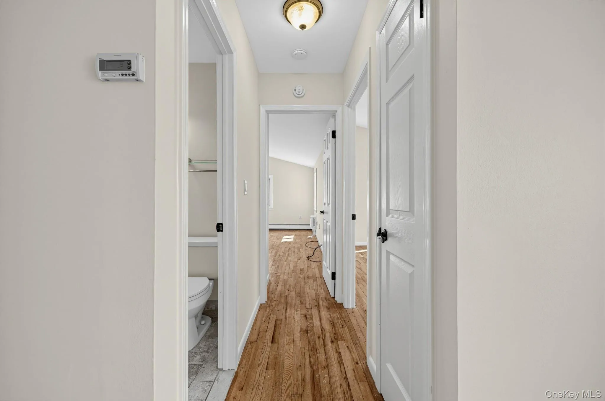 The interior hallway connects the living area with the bedrooms and bath, helping illustrate the apartment’s comfortable layout. The interior hallway connects the living area with the bedrooms and bath, helping illustrate the apartment’s comfortable layout.