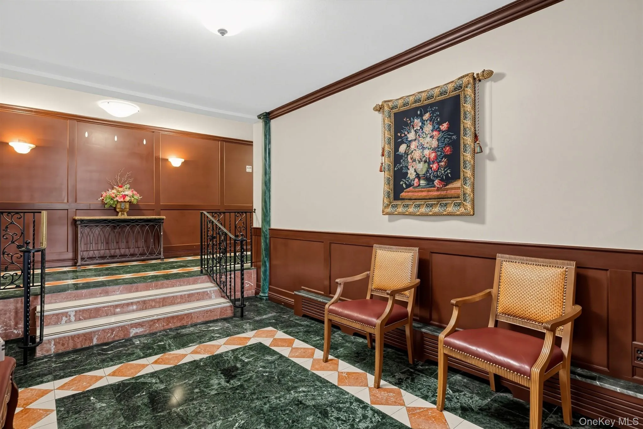 Peldale’s distinctive lobby features decorative flooring, wrought-iron details and inviting common areas. Peldale’s distinctive lobby features decorative flooring, wrought-iron details and inviting common areas.