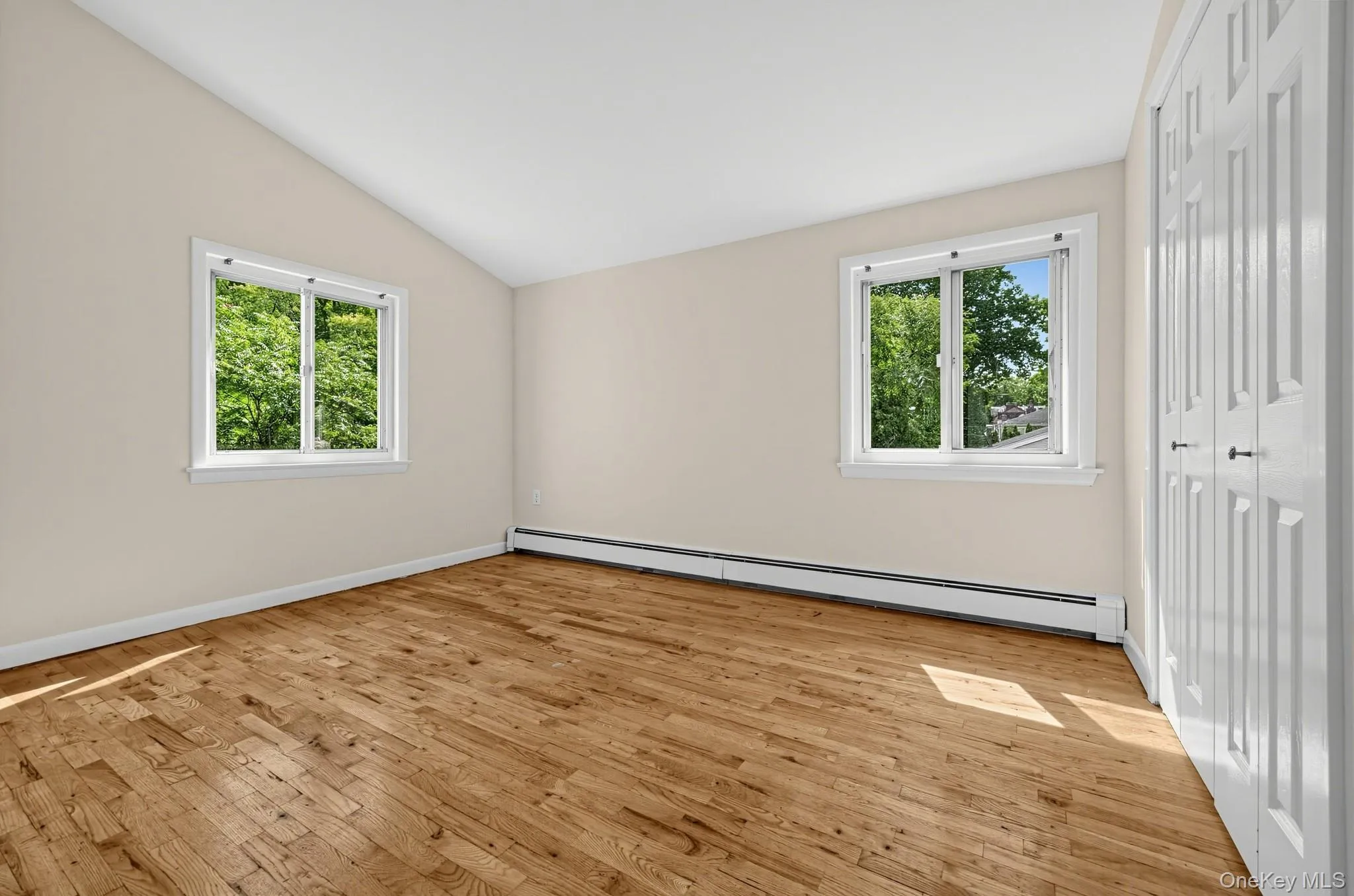 The second bedroom enjoys natural light from two windows, hardwood floors and its own generous closet. The second bedroom enjoys natural light from two windows, hardwood floors and its own generous closet.
