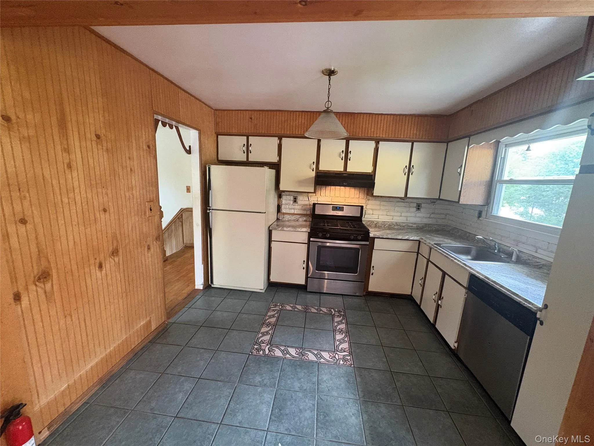 Spacious kitchen with abundant cabinetry and countertop space Spacious kitchen with abundant cabinetry and countertop space