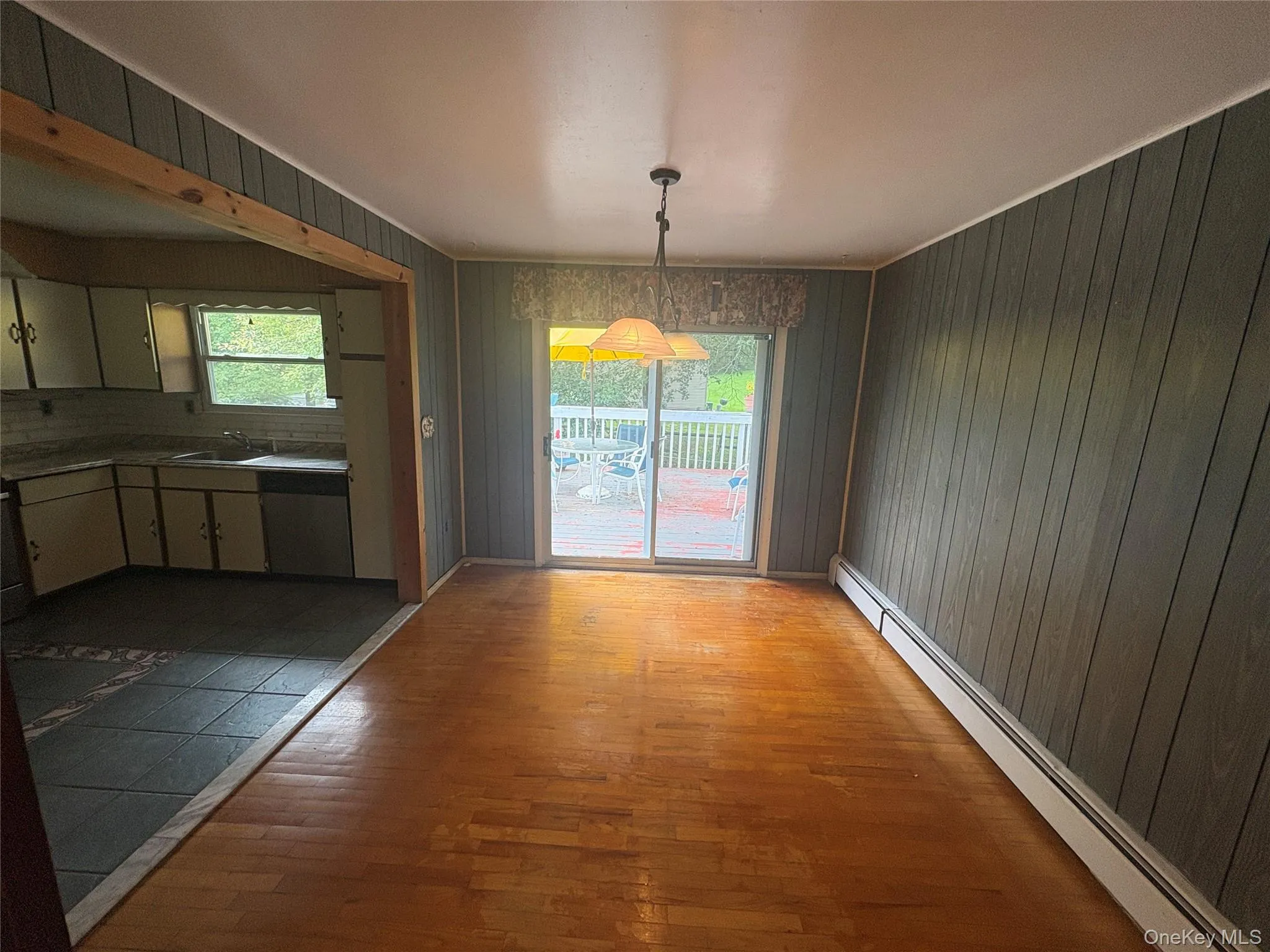 Dining room with hardwood floors and direct access to the deck Dining room with hardwood floors and direct access to the deck