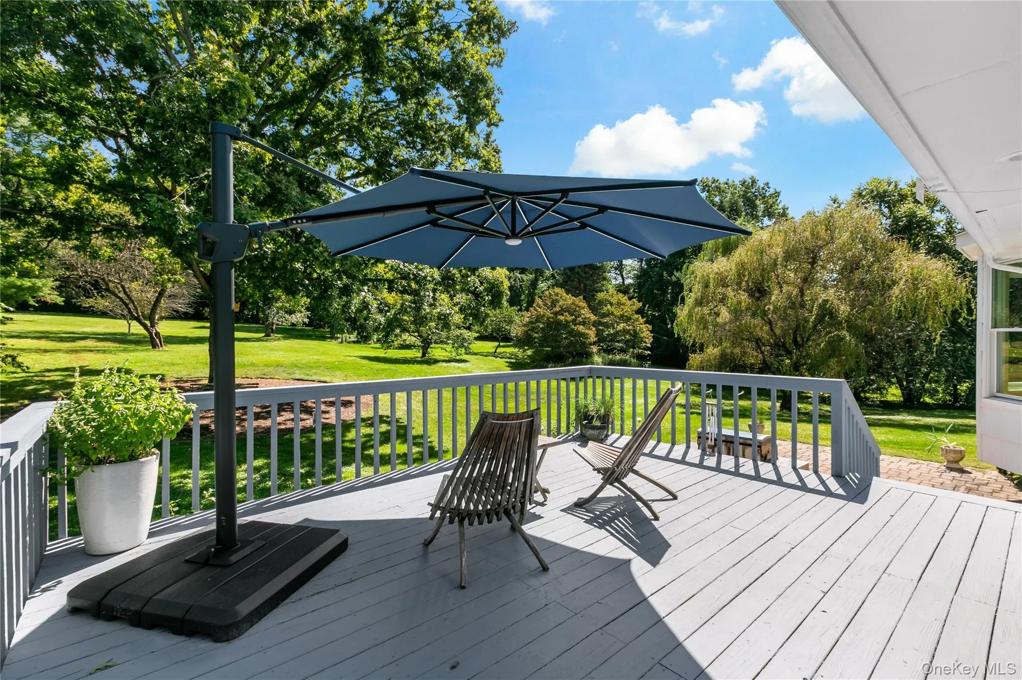 Large deck overlooking the massive grounds. Large deck overlooking the massive grounds.