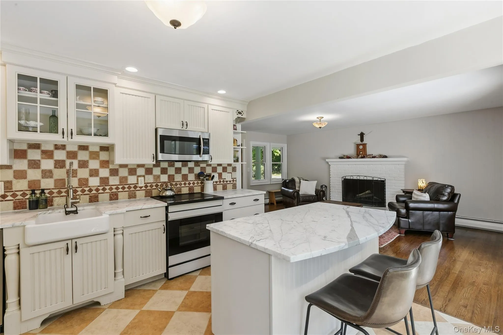 Eat in kitchen with rich Carrara marble countertops. Open to family room. Eat in kitchen with rich Carrara marble countertops. Open to family room.