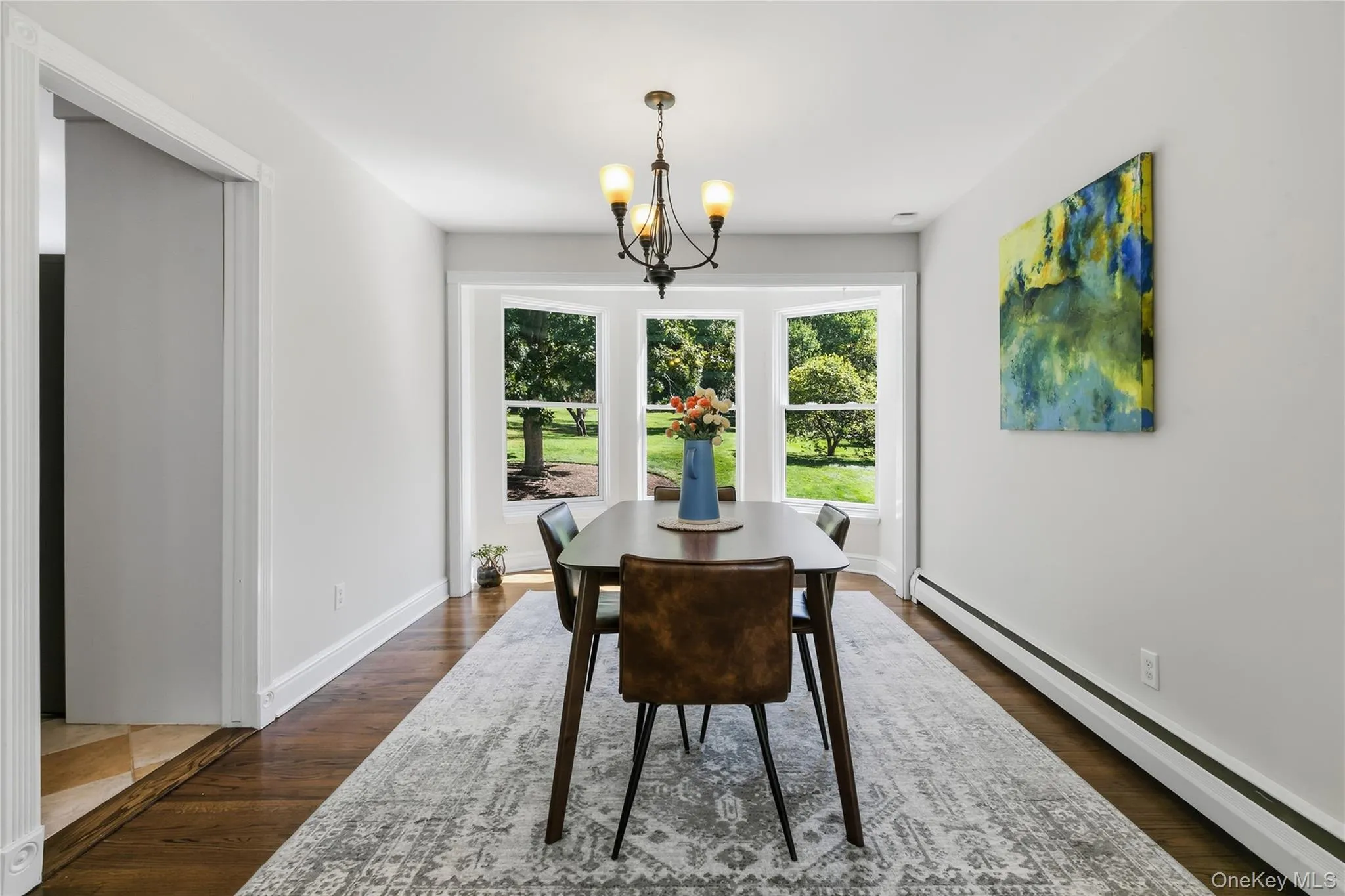 Formal dining room with bay window overlooking the grounds. Formal dining room with bay window overlooking the grounds.