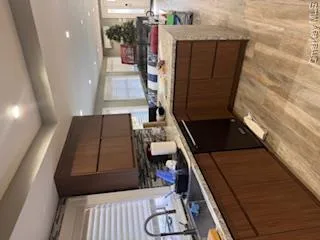 Kitchen with sink, dishwasher, and kitchen peninsula Kitchen with sink, dishwasher, and kitchen peninsula