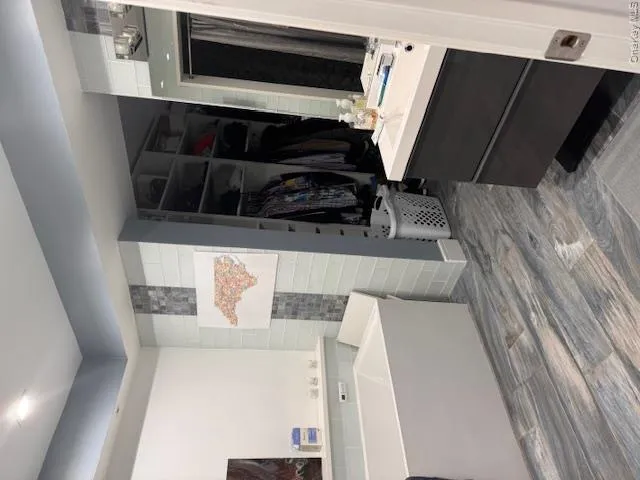 Lower master Bathroom with vanity, a washtub Lower master Bathroom with vanity, a washtub