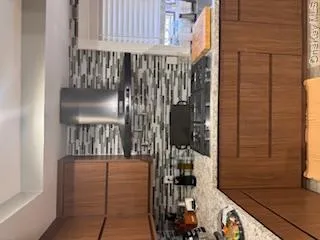 Kitchen with decorative backsplash, stainless steel cooktop Kitchen with decorative backsplash, stainless steel cooktop