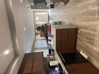 Kitchen featuring dishwashing machine, and kitchen peninsula Kitchen featuring dishwashing machine, and kitchen peninsula