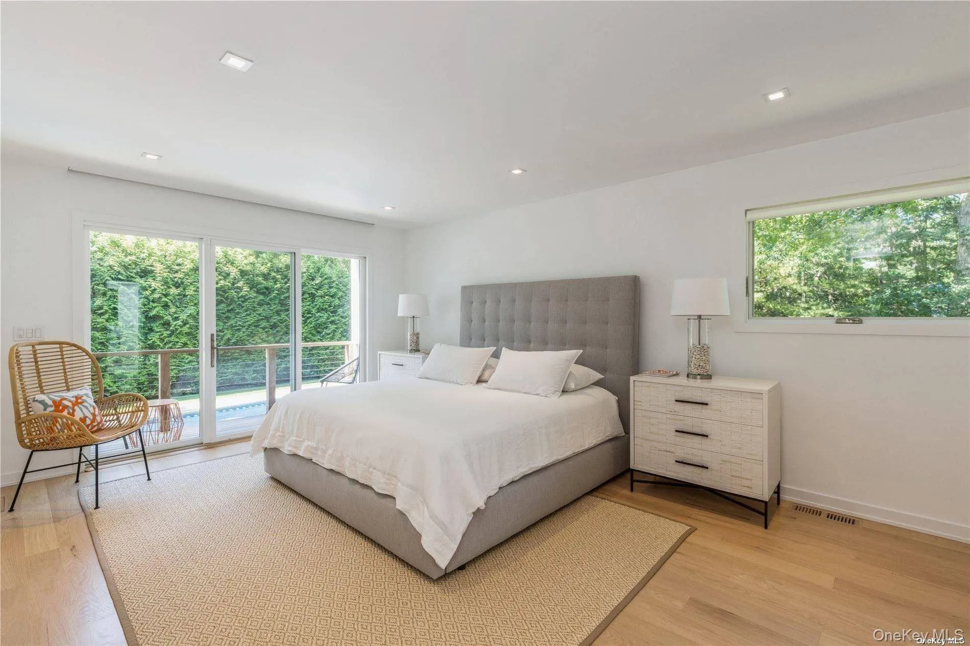 Bedroom featuring access to outside, light wood-style floors, and recessed lighting Bedroom featuring access to outside, light wood-style floors, and recessed lighting